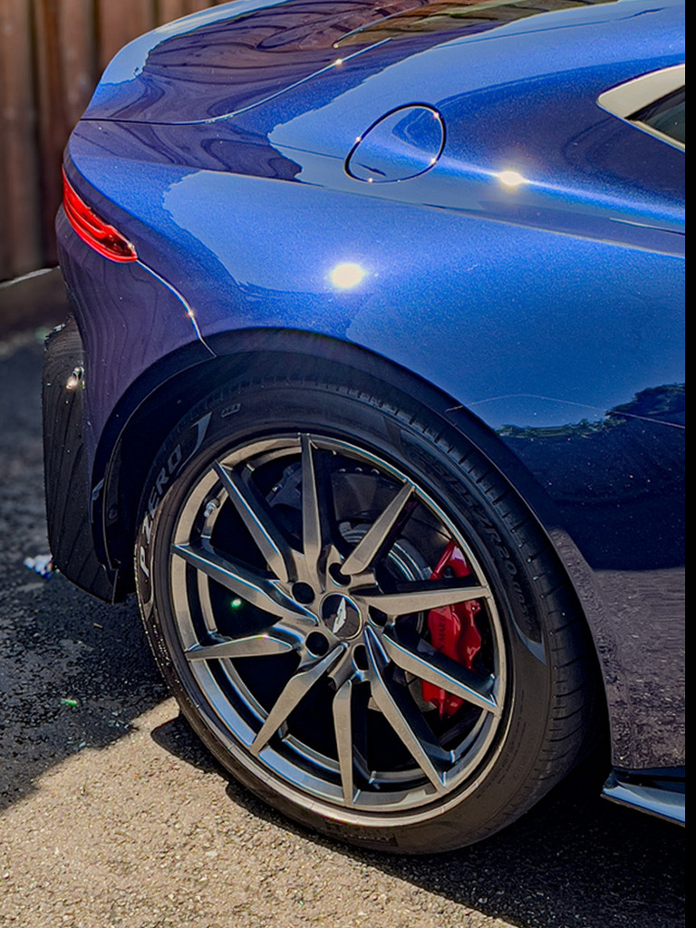 After paint correction, showing the refined finish on blue paint